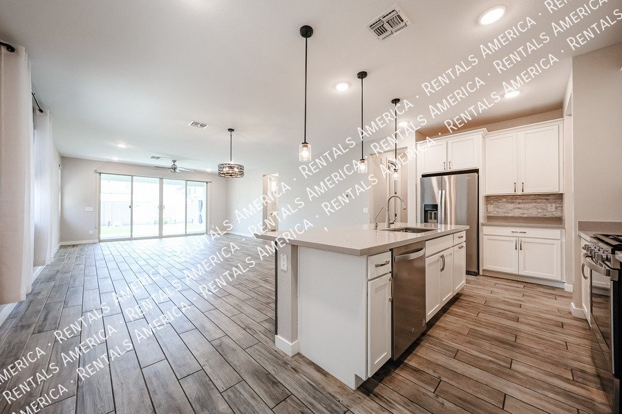 Upgraded 4 Bedroom Home with Private Guest Suite in Harvest property image